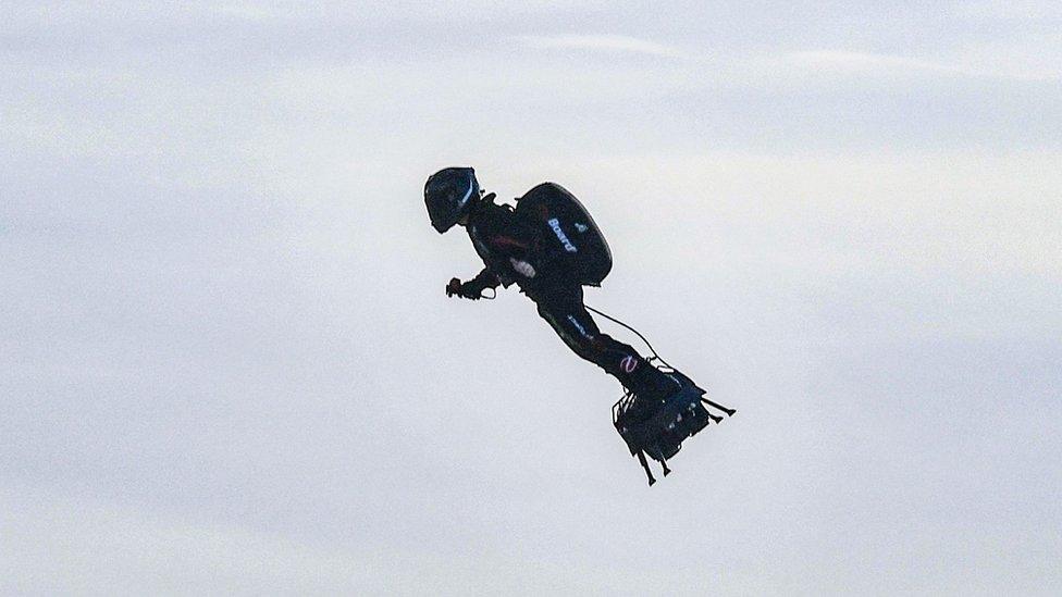 Franky Zapata stands on his jet-powered "flyboard" after he took off from Sangatte, northern France