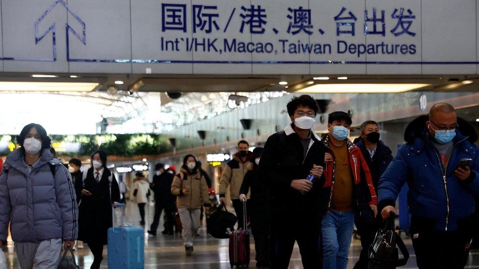 Travellers at Beijing Capital International Airport