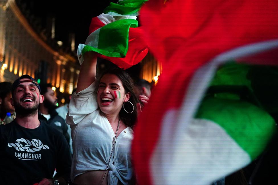 Italy fans celebrate in Piccadilly Circus in central London after their team won the UEFA Euro 2020 Final against England when the game was decided on penalties.