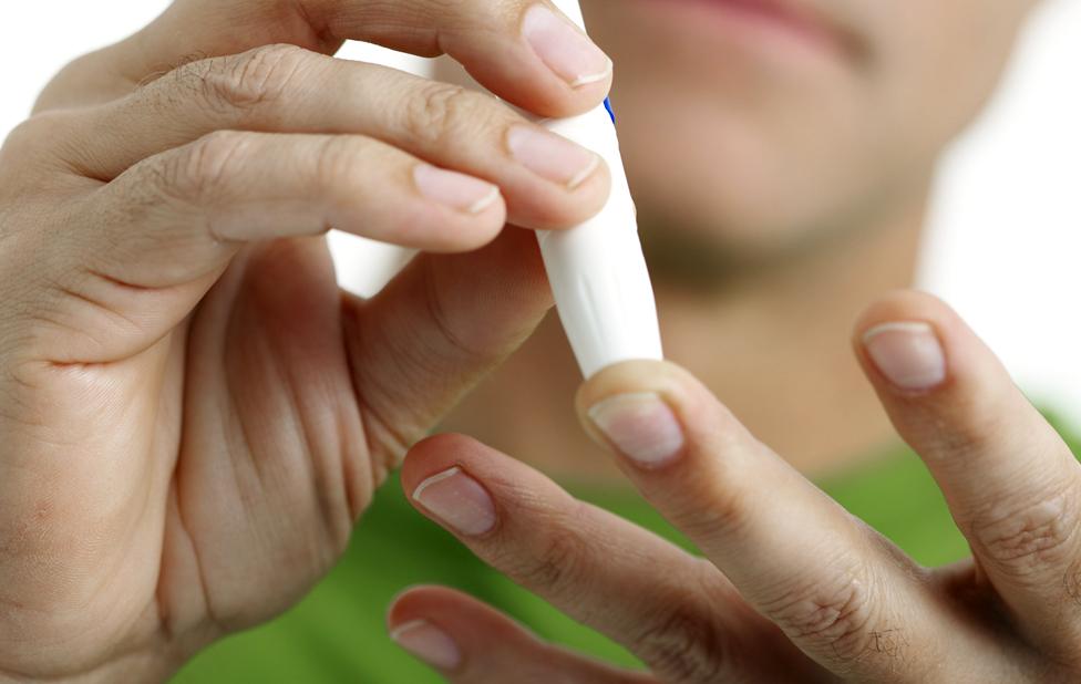 Patient administering finger prick test