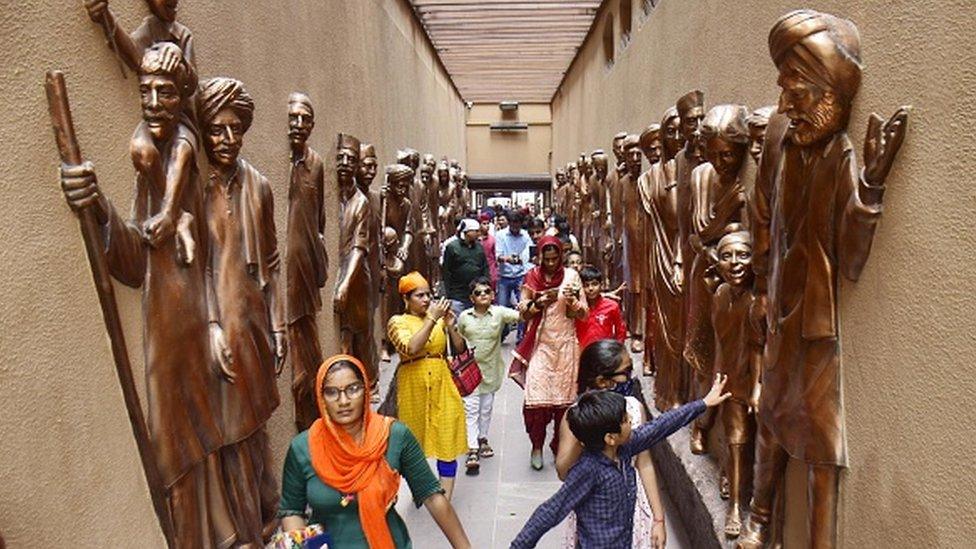 Visitors at the Jallianwala Bagh memorial after its reopening, on August 29, 2021 in Amritsar, India.