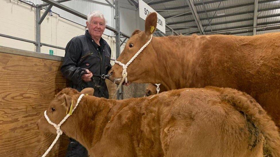 Farmer at show with cows