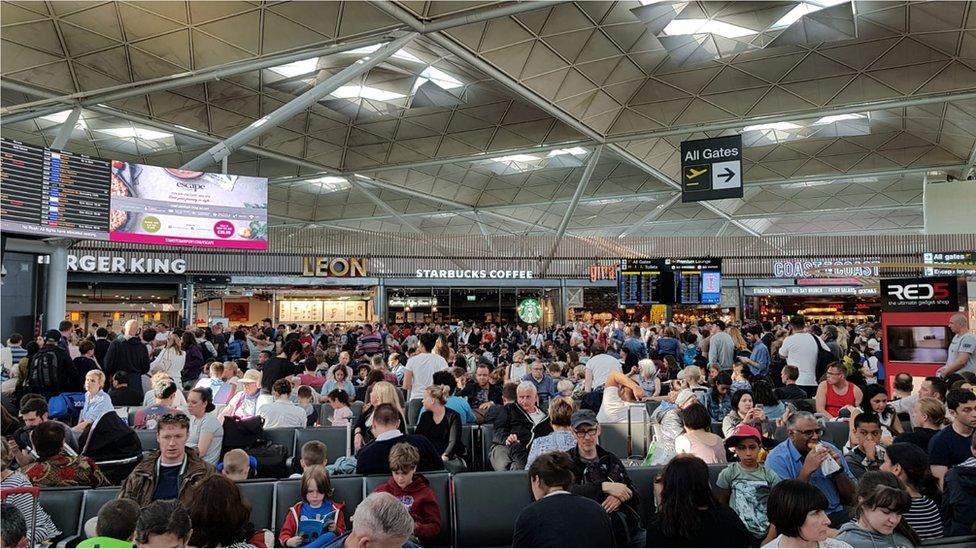 Passengers waiting at Stansted