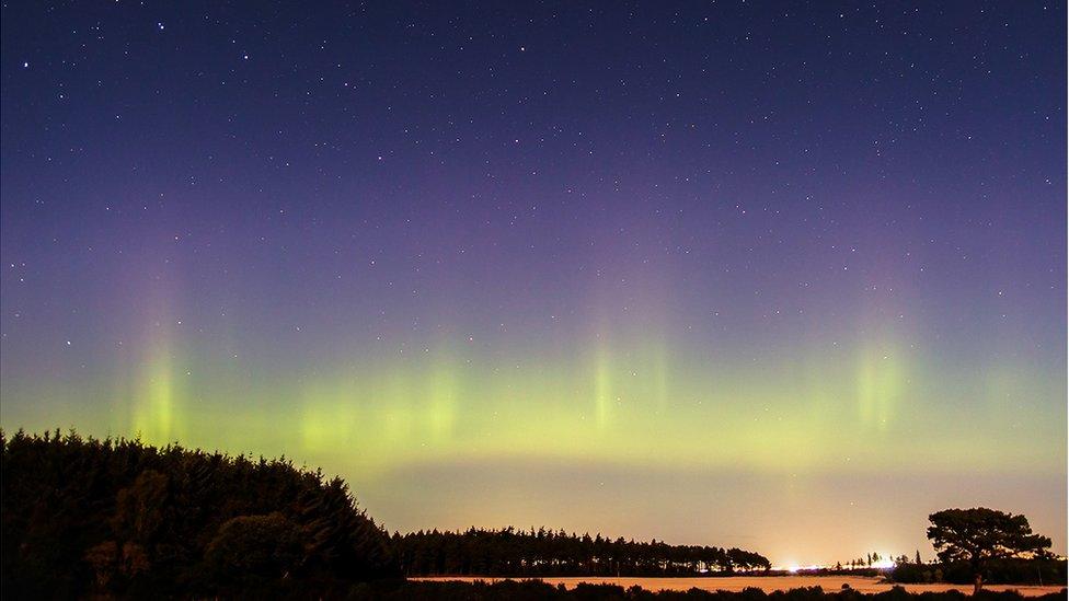 I took this photo during the most intense part of Monday night's northern lights display. Even the bright lights of RAF Lossiemouth and the almost-full Moon couldn't compete with the aurora at this moment.