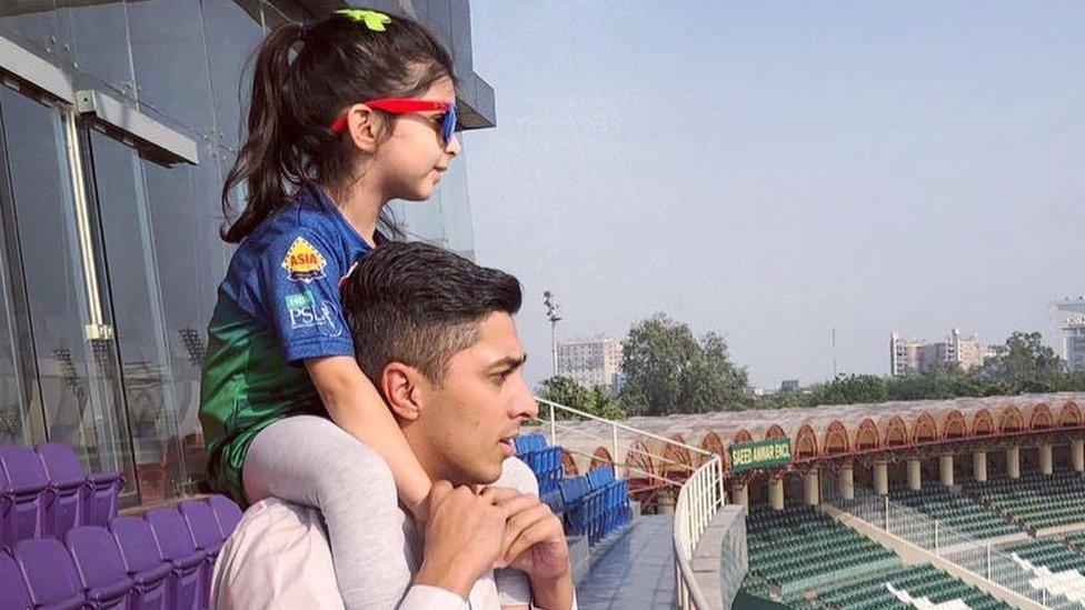 Ali with his daughter