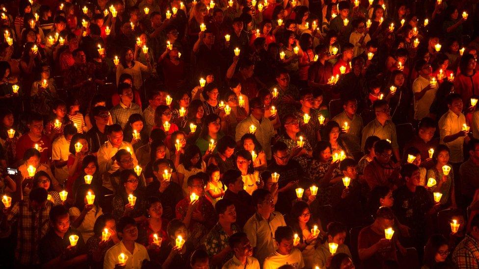 Indonesian Christians attend a Christmas Eve service at a church in Surabaya, East Java province, on 24 December, 2016