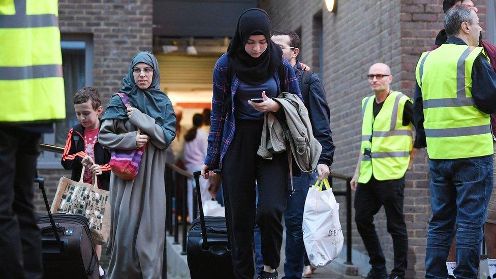 Residents leaving the Taplow block in Chalcots during the evacuation in 2017