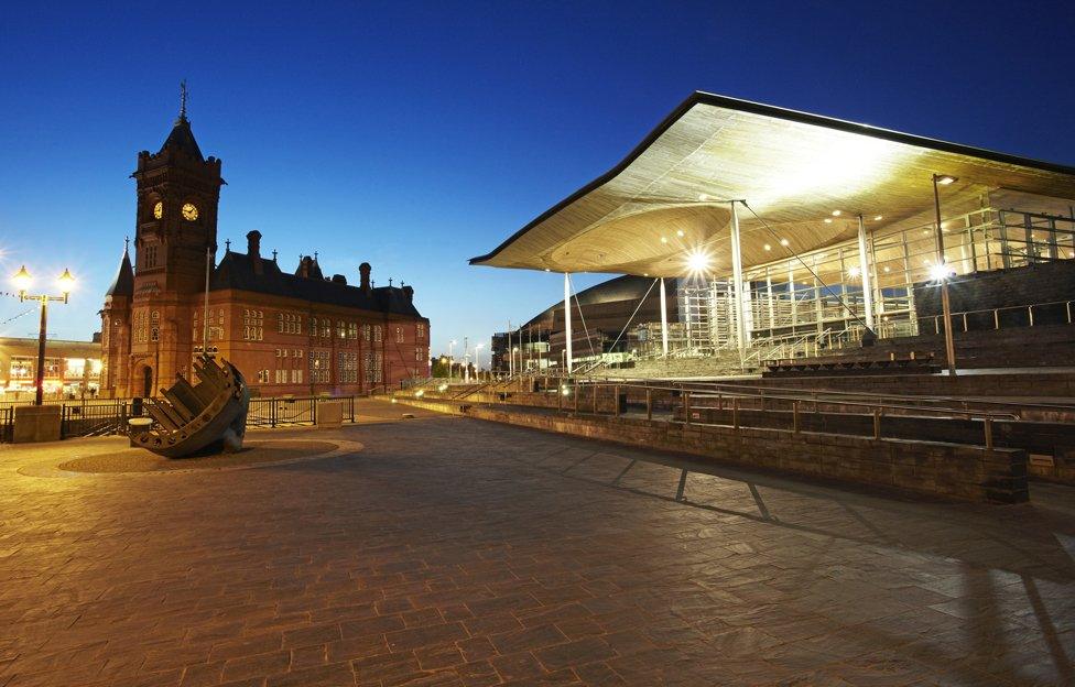 Night shot of the Senedd and Pierhead building