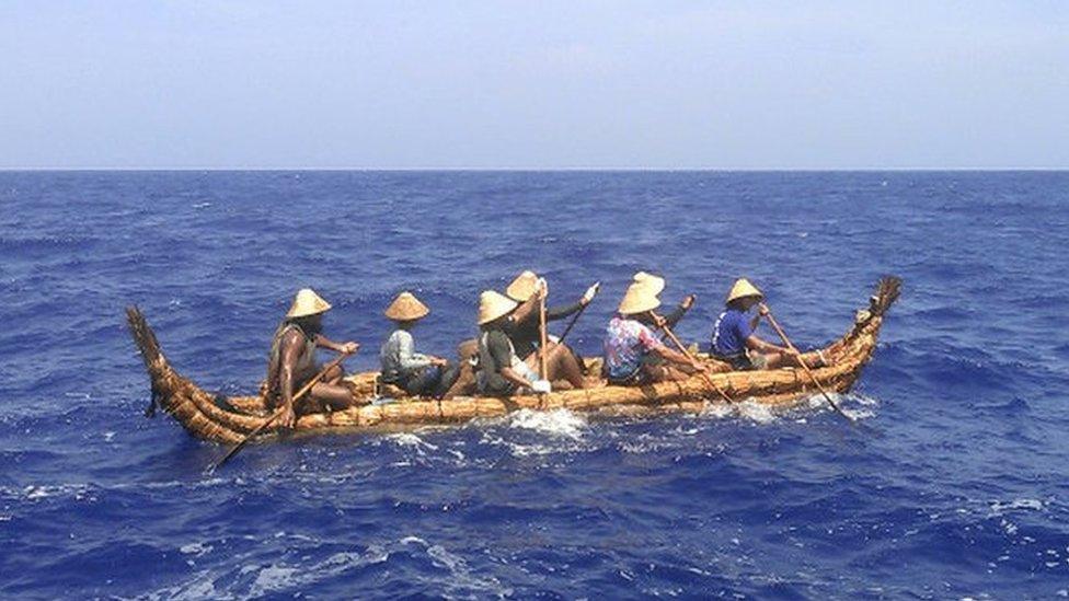 One of the two hand-built canoes being paddled toward Okinawa Prefecture in Japan