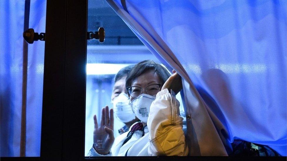 American passenger from quarantined cruise ship in Japan is transported by bus to Tokyo's Hameda Airport for a flight home, 16 February 2020