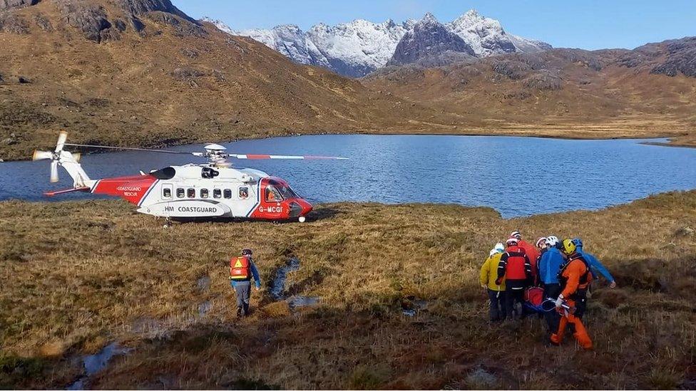 Skye Mountain Rescue Team take Dr John Pike to a Coastguard helicopter