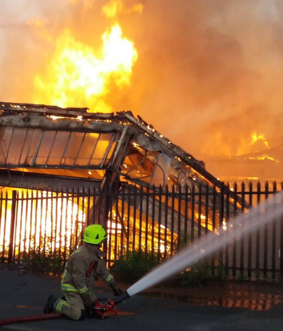 Fireman putting out a fire