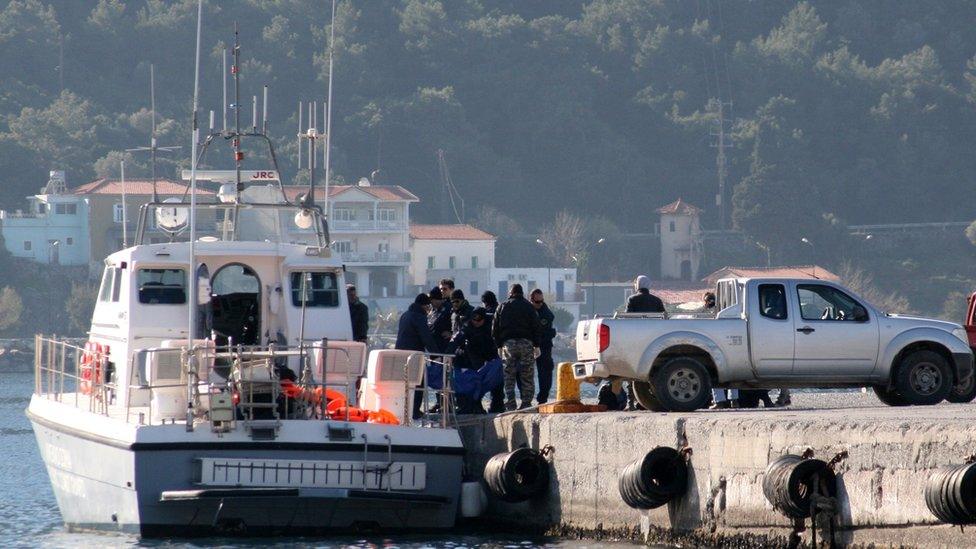 Coast guard removes bodies in harbour at Samos (James Reynolds)