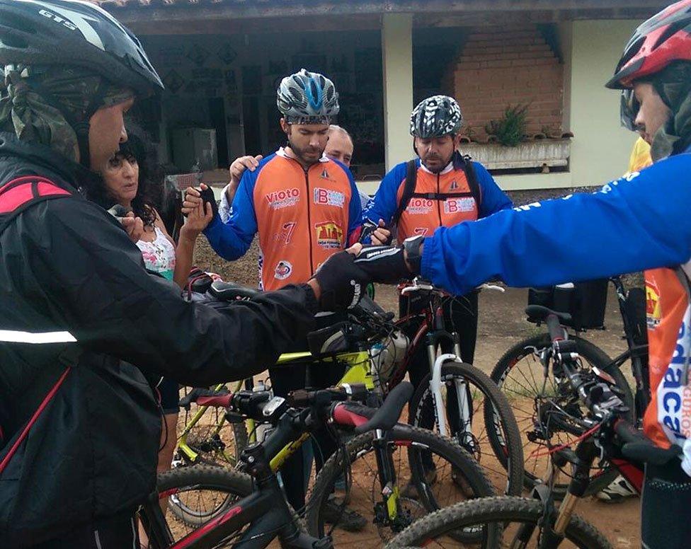 Cyclist-pilgrims join together for morning prayers
