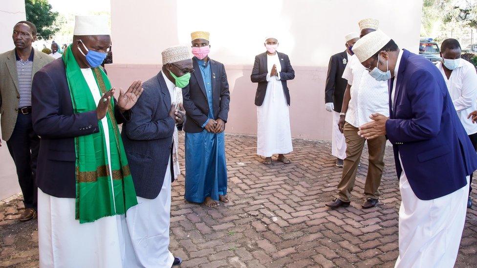 Tanzania's Prime Minister Kaasim Majaaliwa being greeted outside the mosque