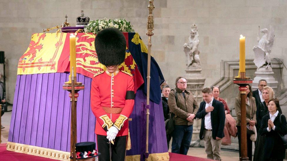 Members of the public file past the coffin of Queen Elizabeth II