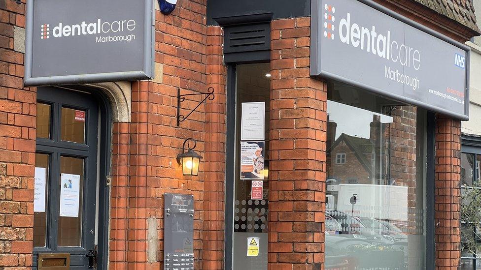 The front of Dentalcare in Marlborough, in the shop front of a red brick building