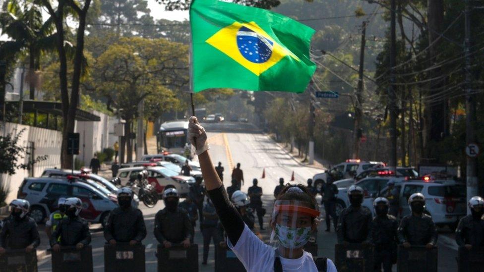 Resident of Paraisopolis favela takes part in Sao Paulo protest