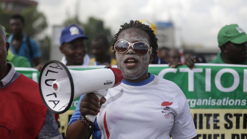 A woman joins in a protest following the removal of a fuel subsidy by the government in Lagos, Nigeria, Wednesday, May 18, 2016