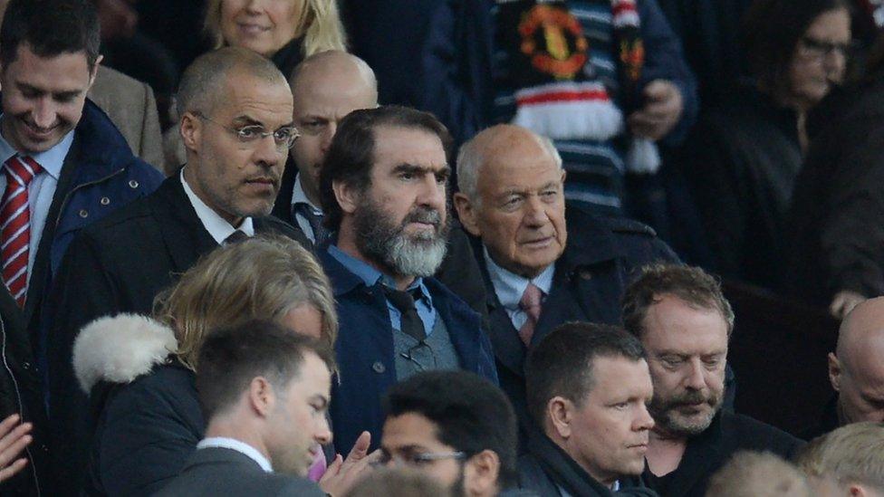 Manchester United's French former player Eric Cantona (C) arrives to watch the English Premier League football match between Manchester United and Leicester City at Old Trafford