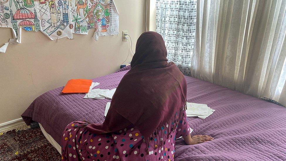 Dure Ahmed pictured on a bed in her Toronto apartment last week