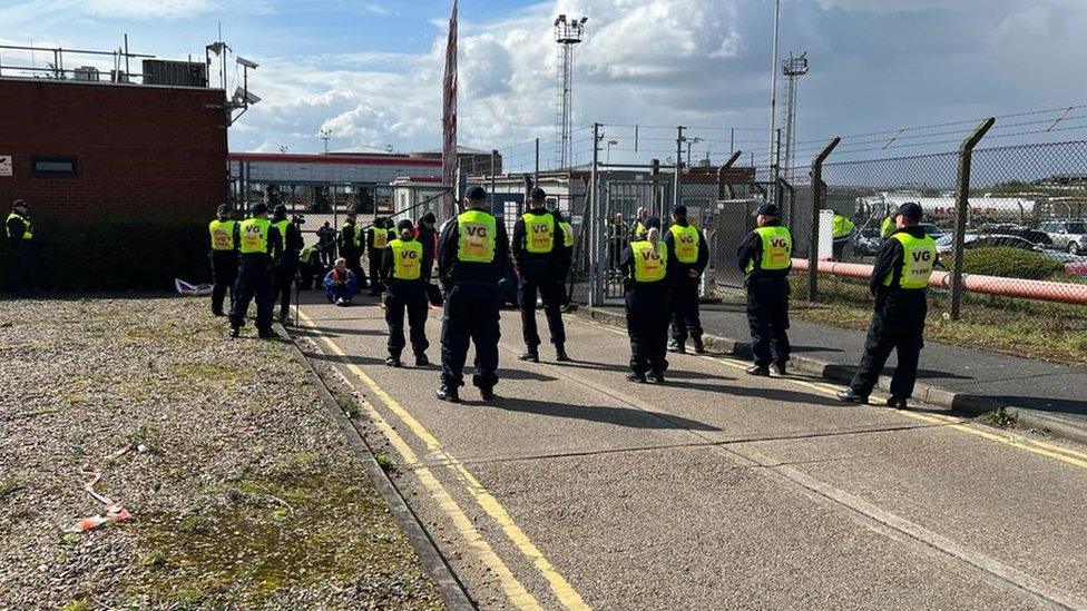 Police and climate change campaigners in Purfleet