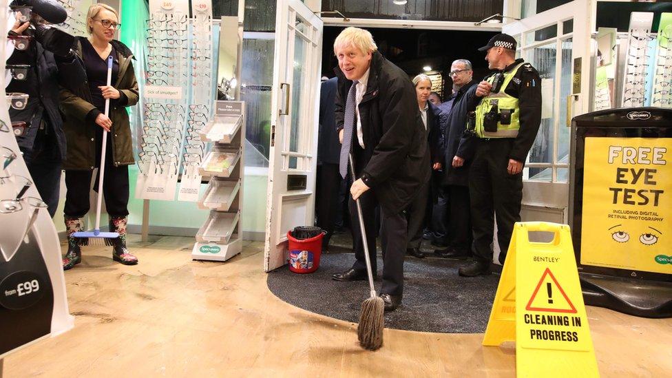 Prime Minister Boris Johnson helping with the clean up in Matlock on Friday evening