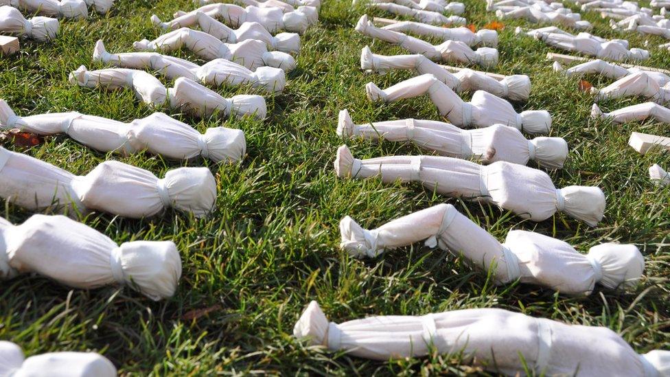 Shrouded figures on College Green