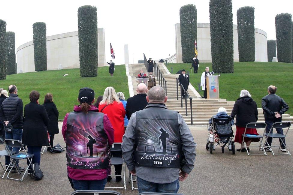 Visitors stand at the National Memorial Arboretum in Alrewas, Staffordshire