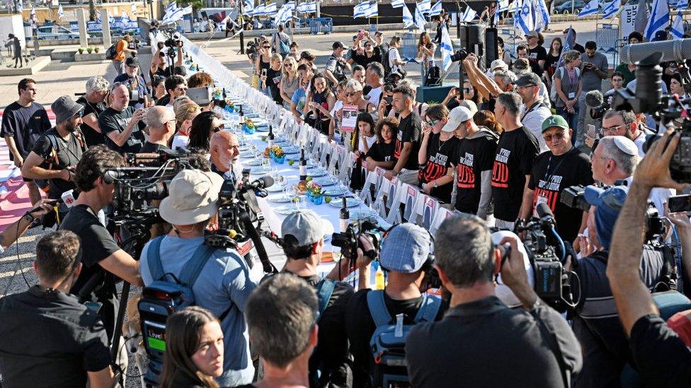 Families of Israeli hostages take part in a special prayer service in Tel Aviv