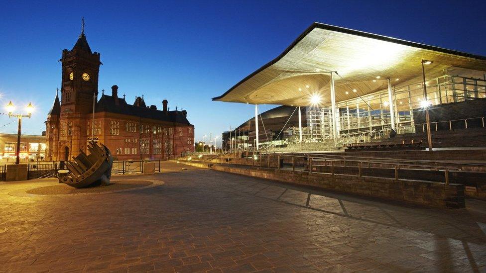 Night shot of the Senedd and Pierhead building