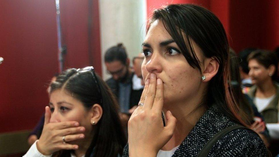 Two women react after hearing the results of the peace deal referendum in Bogota, Colombia, 02 October 2016.