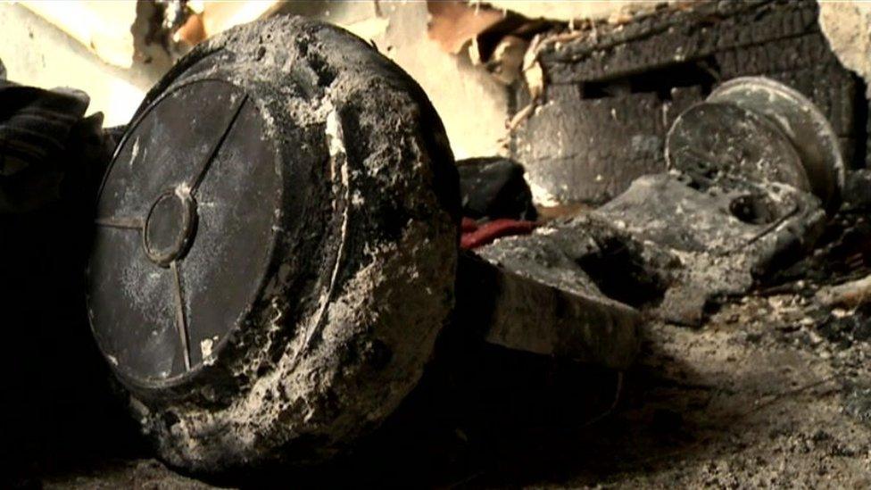 A melted and ash-covered hoverboard after a fire