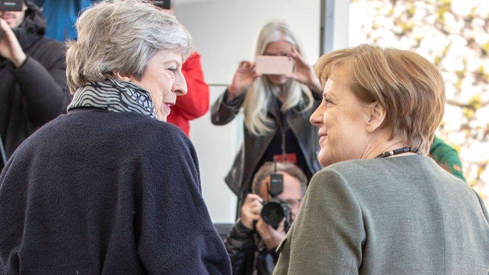 Theresa May and Angela Merkel