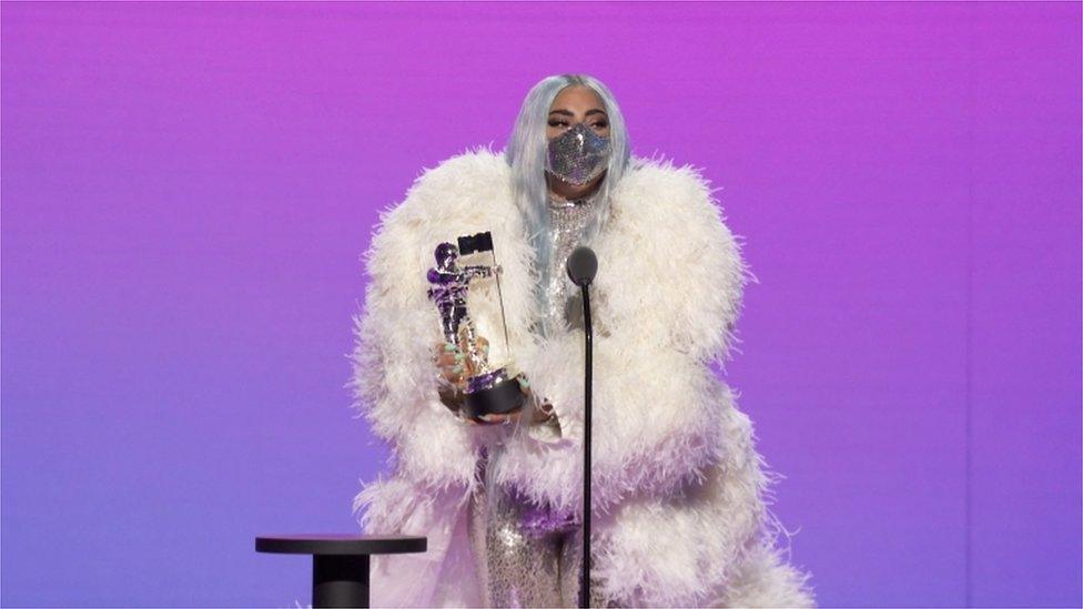 Lady Gaga accepting an award