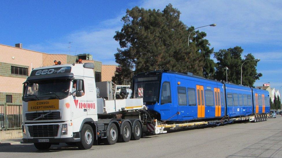 Tram-train on transporter