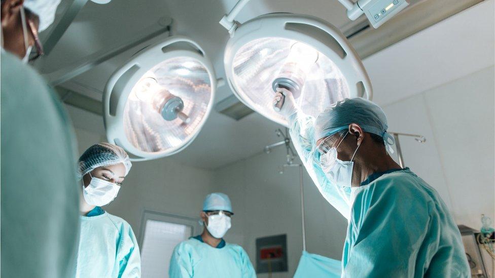 Surgeons in an operating theatre