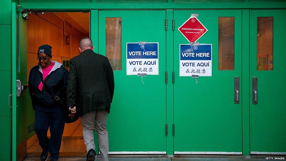 Voters enter a polling station in New York City to vote on the president