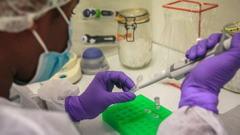 Institut Pasteur laboratory workers perform PCR (Polymerase Chain Reaction) tests to determine whether patients are positive for the new COVID-19 coronavirus, in Antananarivo, April 23, 2020