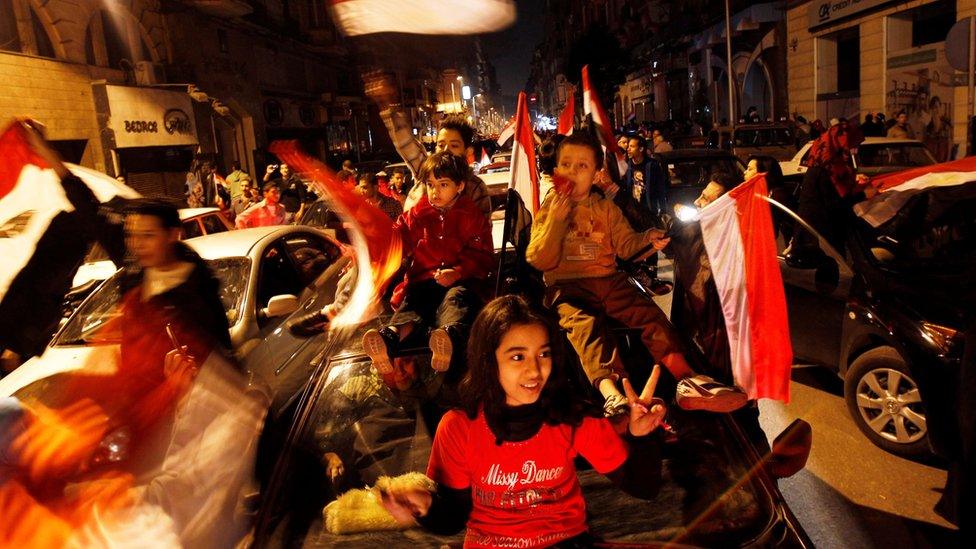 Egyptians celebrate after Egyptian President Hosni Mubarak's resignation in Cairo (11 February 2011)