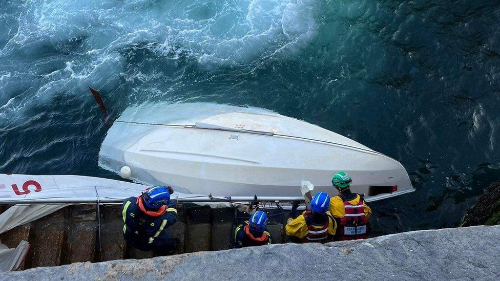 Coastguard with upturned dinghy