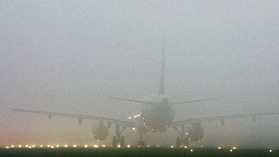 Plane in fog