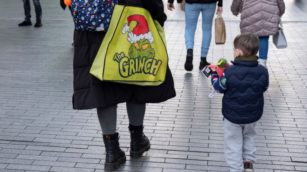 Adult and child on high street