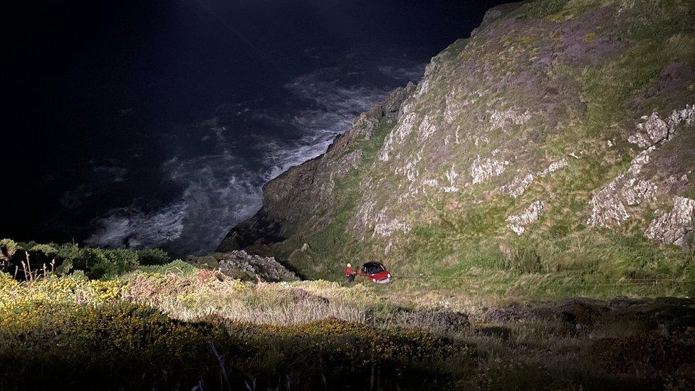 Car at bottom of cliff