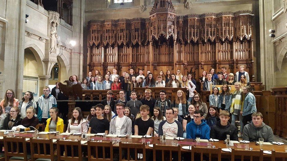 Students sitting in the Mansfield Hall