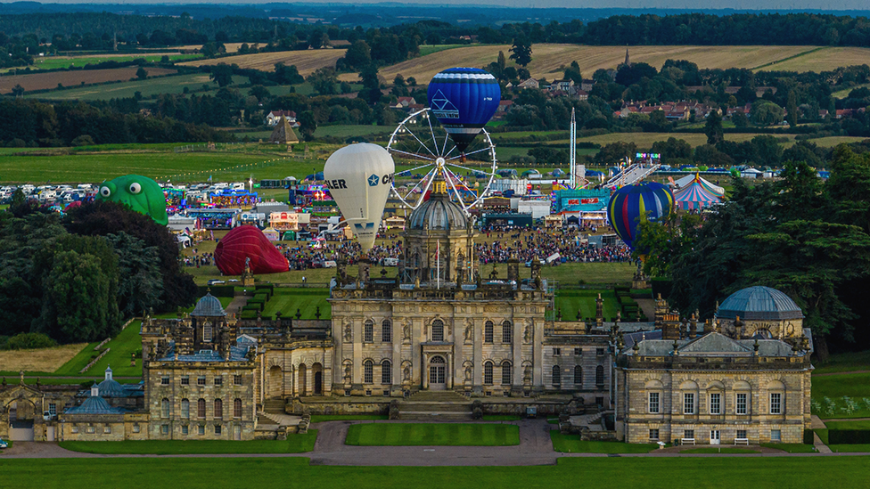 Hot air balloons flying over Castle Howard