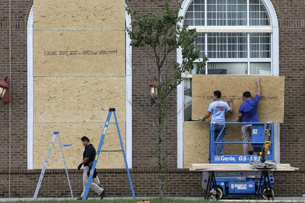 Men repair windows in Charlotte