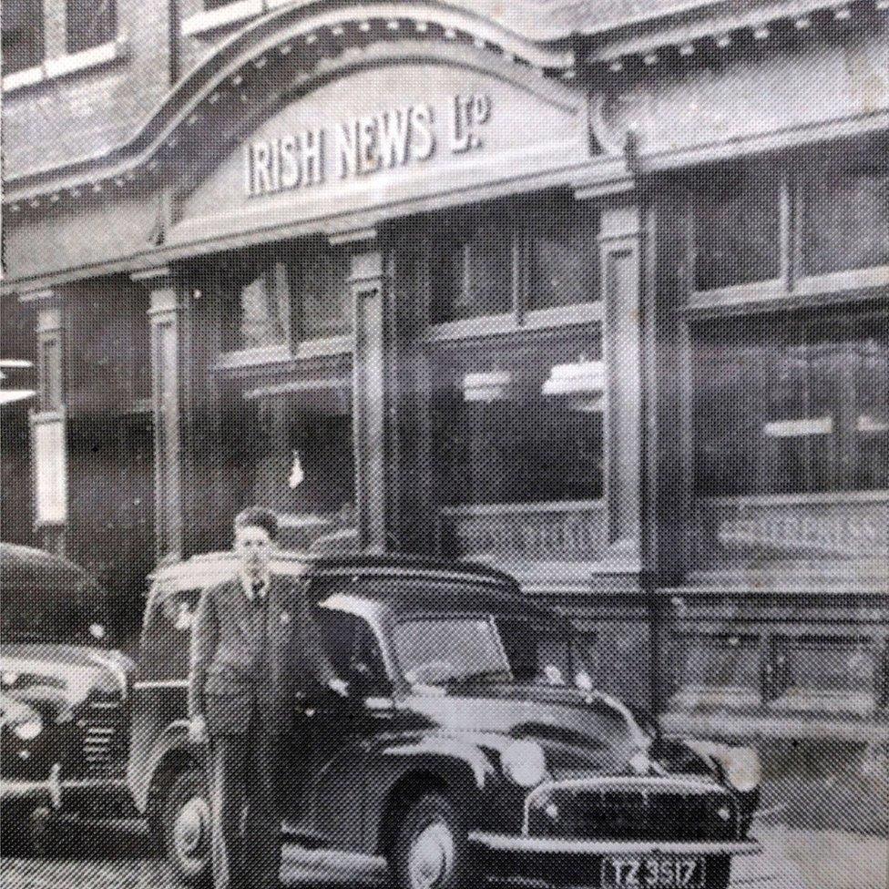 Archive photo of man pictured outside Irish News, he is leaning on an old-style van