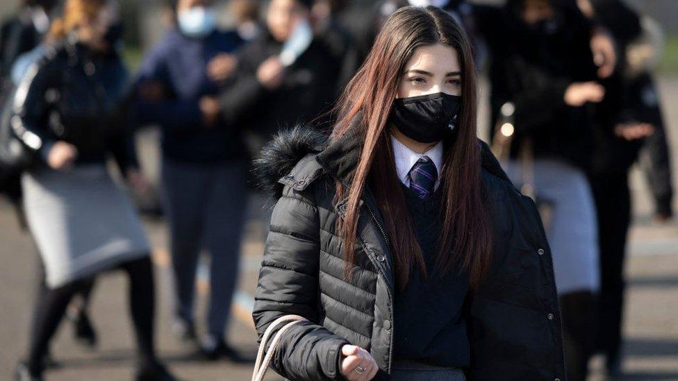 Girl at school in face mask