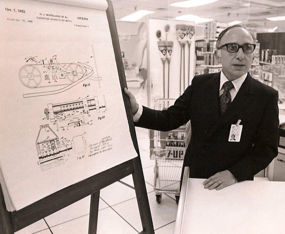 Joseph Woodland explaining his prototype scanner for products with bar codes in 1952